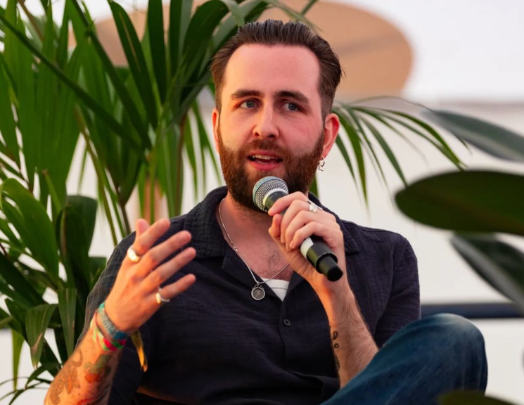 A photo of Jake speaking at Reading Festival